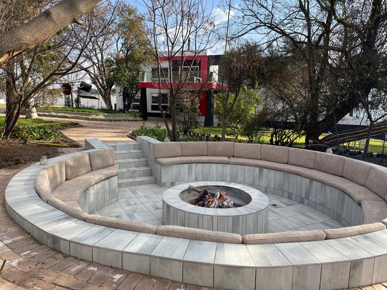 The Fire Lounge outdoor fireplace at Lora Gardens